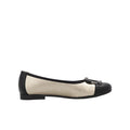 Women’s flat pumps: cream upper, black toe cap, buckle strap, round toe