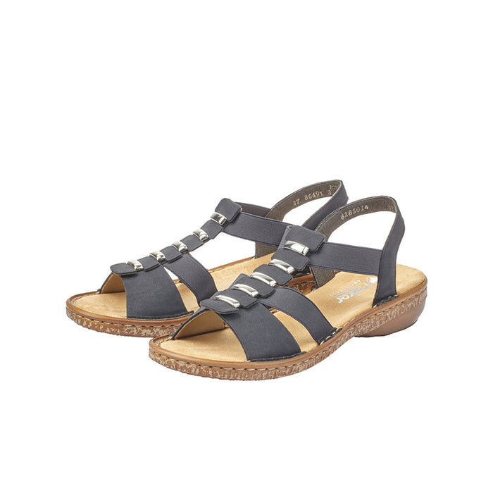 Pair of women's blue slide sandals with buckle straps and cushioned platform sole