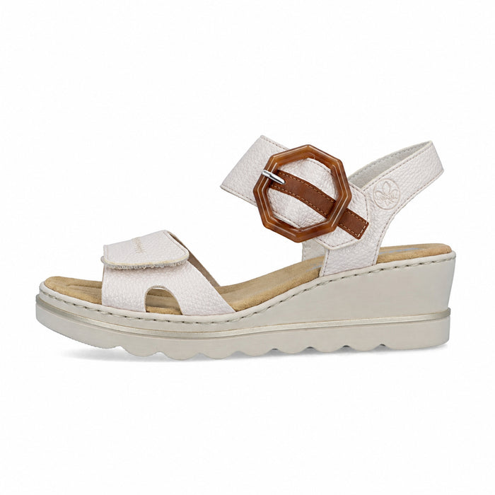Women’s white wedge sandals with tan hook-and-loop buckle strap and textured sole