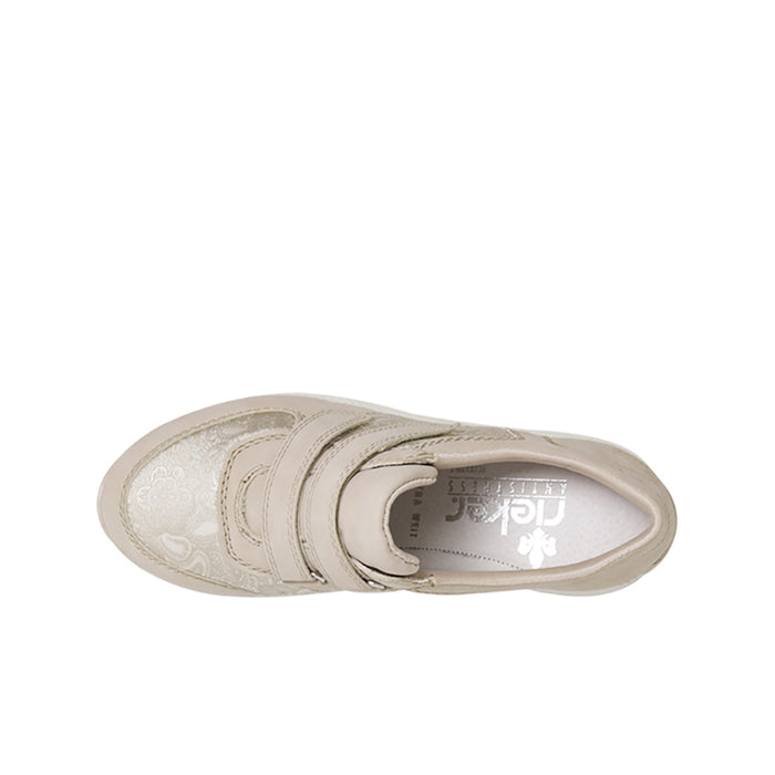 Beige sneaker interior view with hook-and-loop straps and padded collar