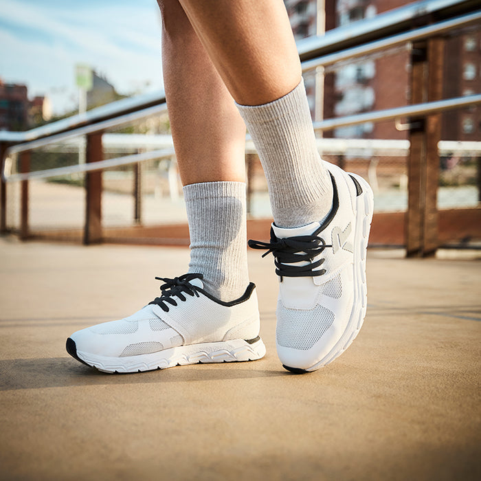 Rieker lace-up sneakers worn, white uppers with black laces and ribbed socks