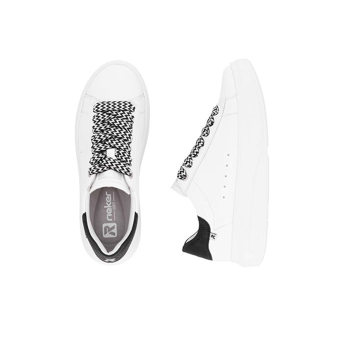 White sneakers with black zigzag laces, black heel tab, and low profile sole