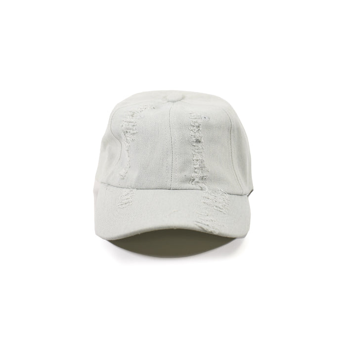 Distressed light wash denim baseball cap with heavy ripped texture and streetwear vibe on white background.