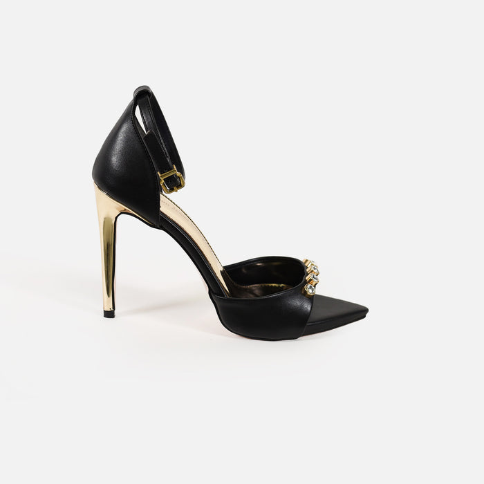Rock black pointed toe heels with gold stiletto, rhinestone embellishments, and an adjustable ankle strap for a night out.