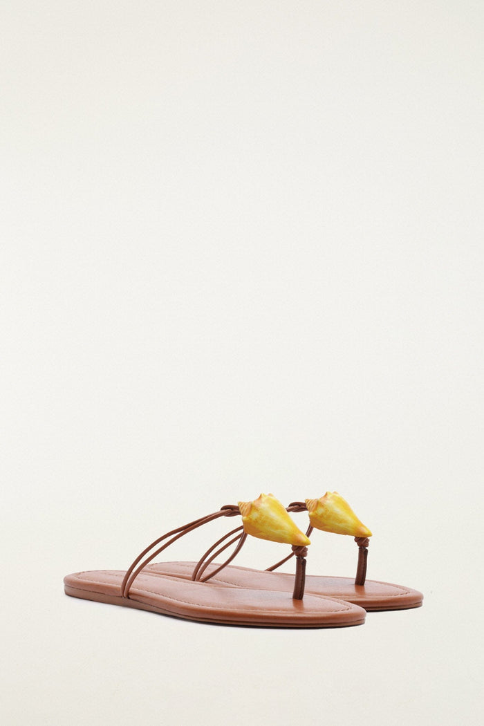 FARM Rio model wearing the Shell Flat Sandal