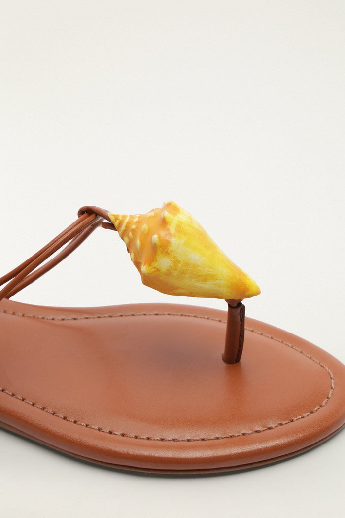 FARM Rio model wearing the Shell Flat Sandal