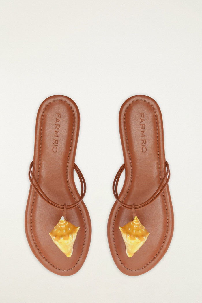 FARM Rio model wearing the Shell Flat Sandal