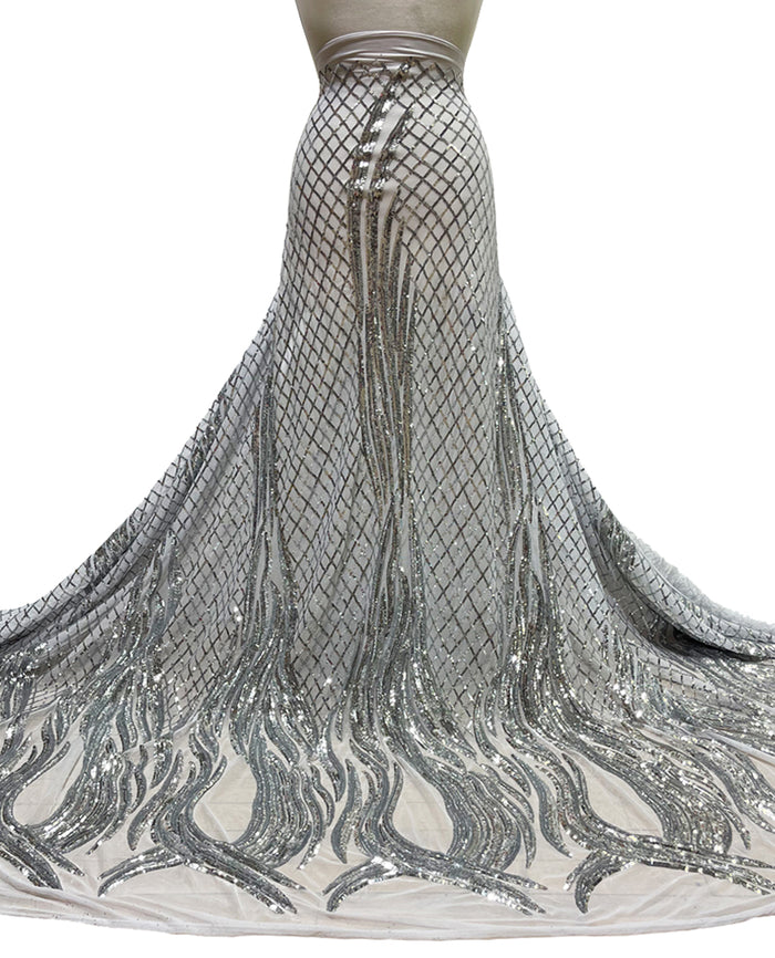 A stretch mesh bridal fabric with silver sequins and embroidery, likely used for creating a dress or costume.