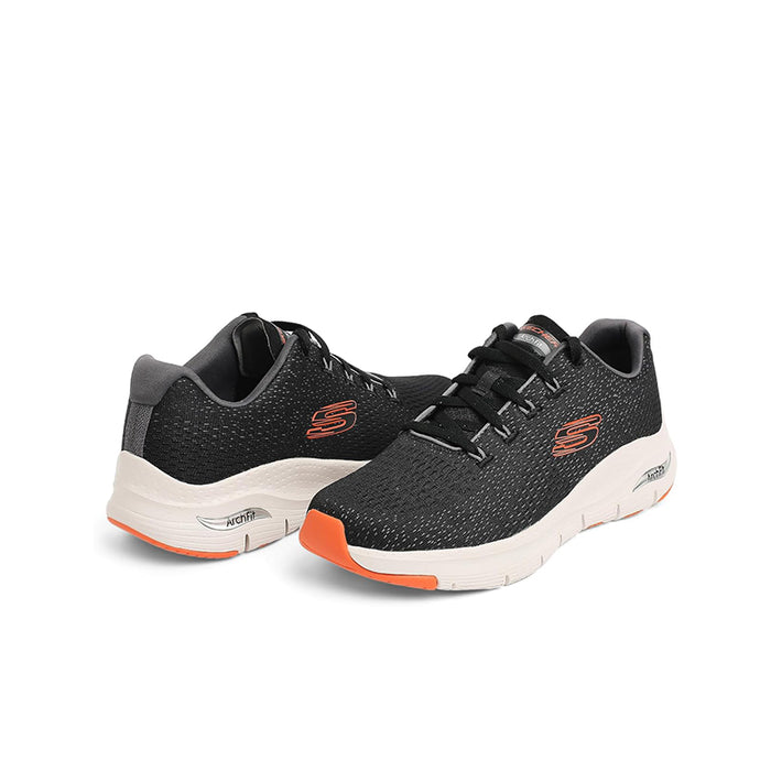 Black mesh men's sneakers with white sole and orange accent on outsole