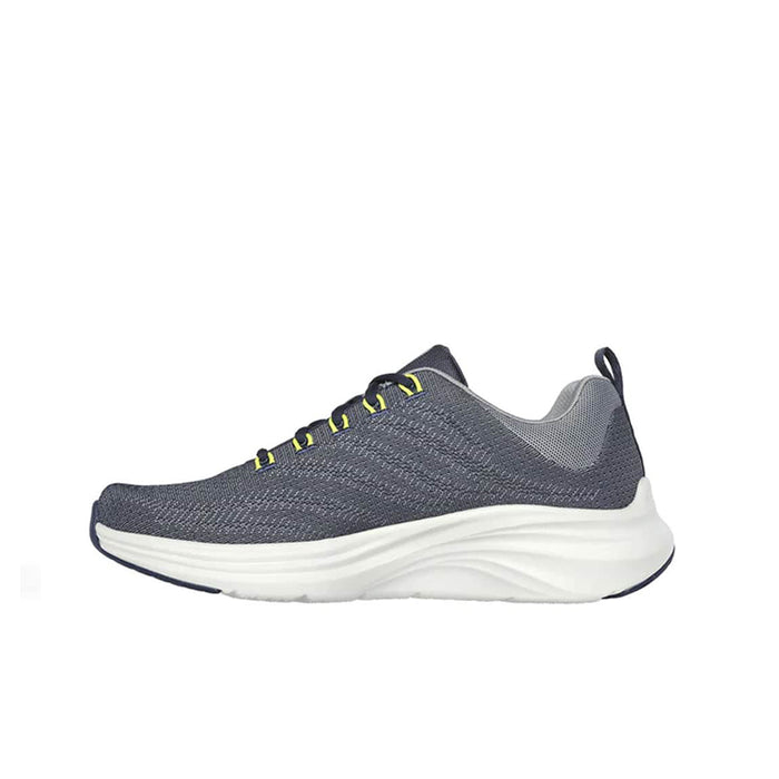 Men's navy gray knit sneakers with neon yellow laces and thick white sole