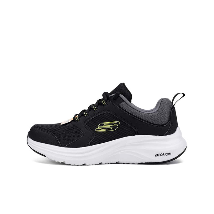 Black mesh men’s sneaker side view with white sole and neon lime S logo