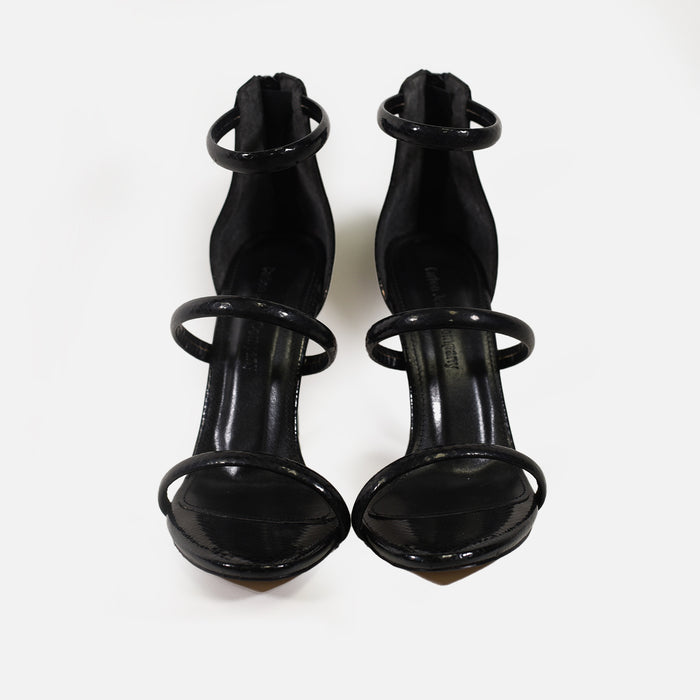 Black Skin Heels: Pointed-toe stiletto pumps featuring three snakeskin-textured straps and a high ankle back.