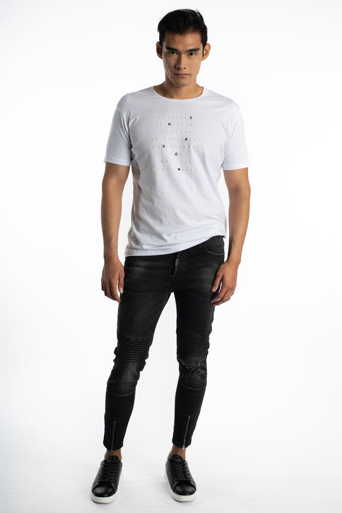 Model in Soren black washed slim fit moto jeans with ribbed knee panels, ankle zippers, and streetwear aesthetic.