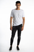 Model in Soren black washed slim fit moto jeans with ribbed knee panels, ankle zippers, and streetwear aesthetic.