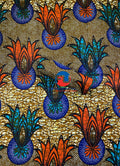 A vibrant ankara wax print fabric featuring geometric patterns in orange, teal-green, blue, black, white, and peanut-brown colors on a gold background.