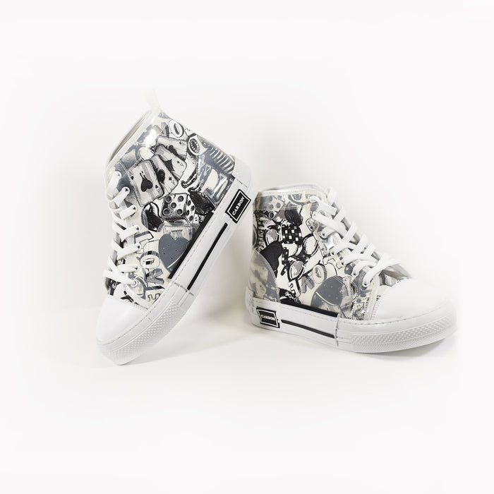 Carbon Star mid-top streetwear sneakers with black and white urban street art graphics, white laces, and rubber soles.