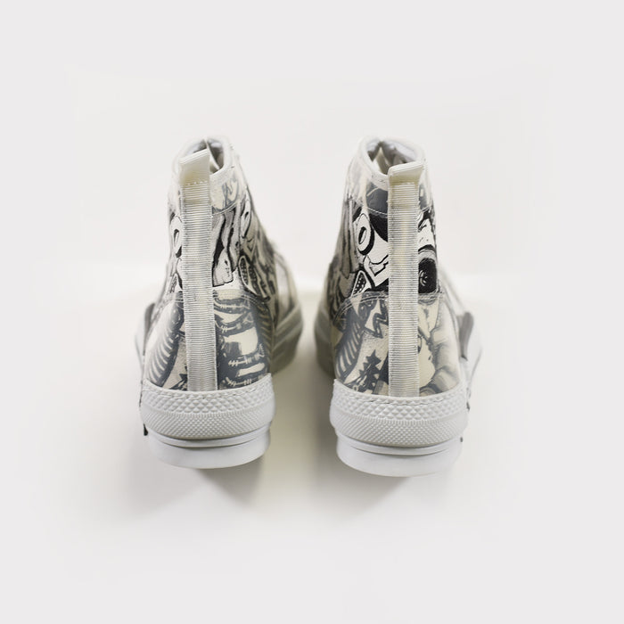 Rear view of Carbon Star Mid-Top sneakers in white canvas with black urban graffiti print and rear pull tabs.