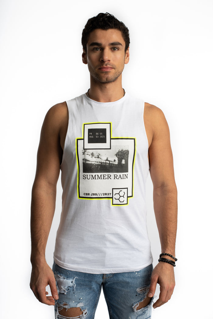 Model in Carbon Jeans Summer Rain white tank top with neon yellow graphic print and distressed streetwear denim.