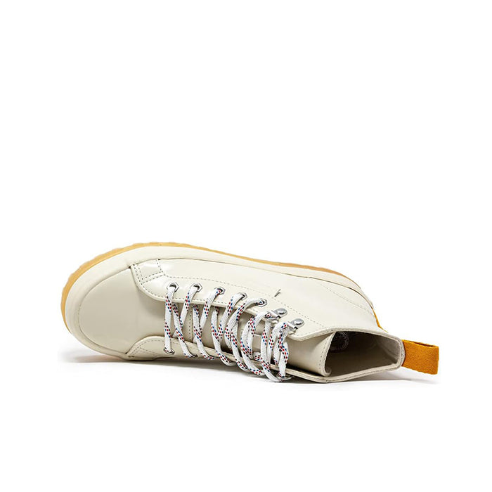 Beige leather women’s lace-up boot shown from side with textured rubber sole