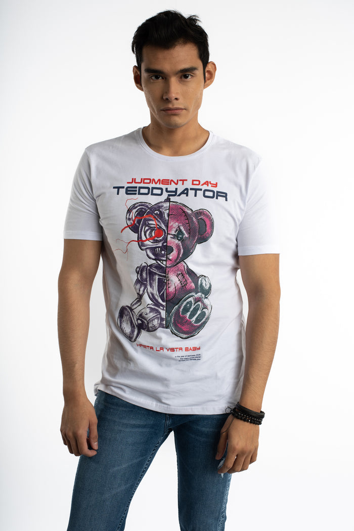 Man in white Teddyator streetwear graphic t-shirt featuring a half-cyborg teddy bear and crew neck, styled with blue jeans.