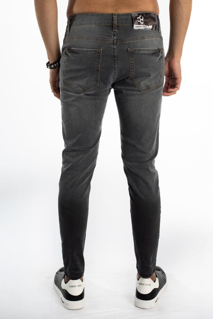 Rear view of Zayn Slim Fit Grey Denim Jeans for men showing back pockets, Carbon brand patch, and tapered leg.